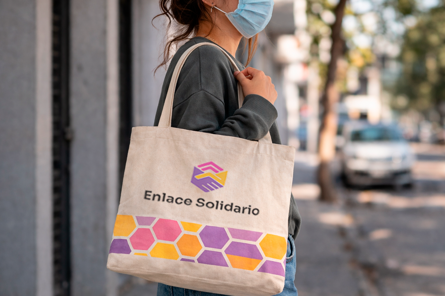 Enlace Solidario — brand identity with hexagonal logo and community photography